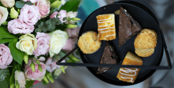 platter of sweet treats and flowers